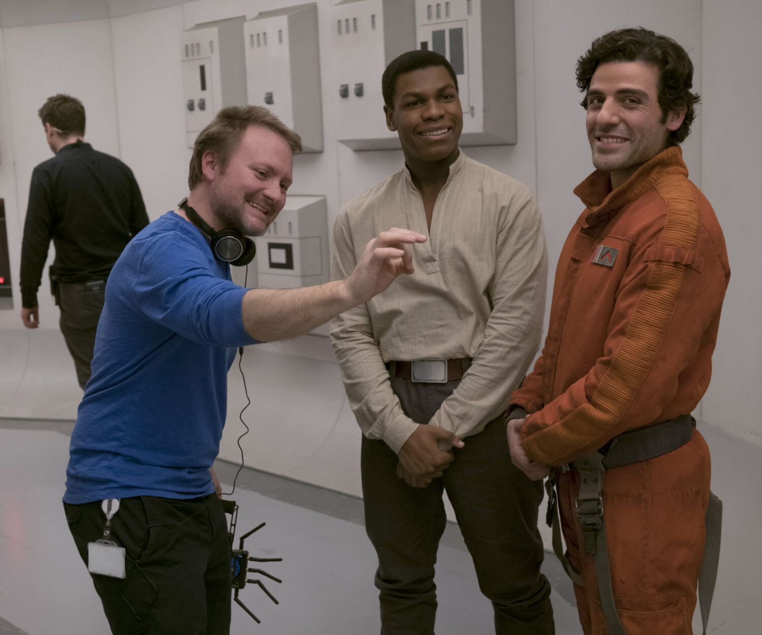 Star Wars: The Last Jedi..L to R: Director Rian Johnson on set with John Boyega (Finn) and Oscar Isaac (Poe Dameron)..Photo: David James..©2017 Lucasfilm Ltd. All Rights Reserved.